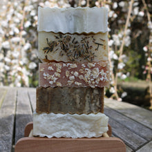 a stack of five natural College Green soaps