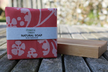 Handmade natural soaps: stack of five wrapped soaps